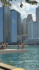 Backflip off a white platform over turquoise water in Chicago