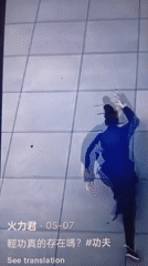 Person in dark clothing rapidly climbs tiled wall