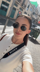 Woman films selfie video on Tel Aviv street
