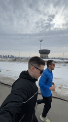 Group of runners jog winter path in Kazan