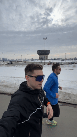 Group of runners jog winter path in Kazan