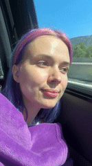 Purple-haired person takes car selfies in Pourrières, France
