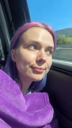 Purple-haired person takes car selfies in Pourrières, France