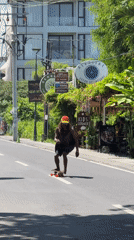 Barefoot skateboarder spotted on North Kuta road during sunny morning