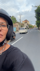 Motorcyclist with distinctive jewelry spotted riding in Abiansemal, Indonesia