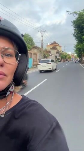 Motorcyclist with distinctive jewelry spotted riding in Abiansemal, Indonesia