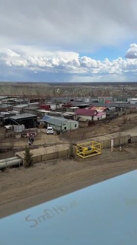 Spring thaw documented at Mirny stadium, settlement views