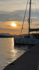 Sunset documented at Poros harbor with moored vessels