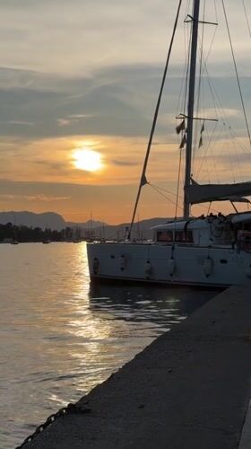 Sunset documented at Poros harbor with moored vessels