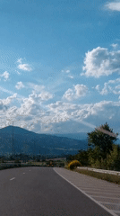 Driver documents mountain highway journey in rural area