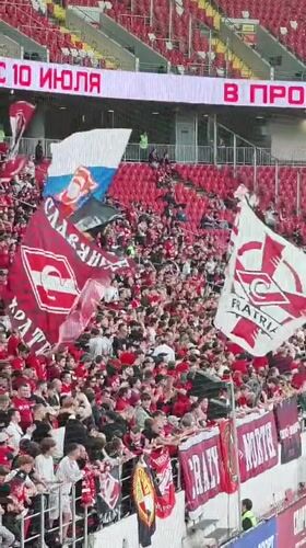 Soccer match kicks off in Khimki stadium, fans in full red
