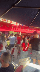 Multinational outdoor gathering under flags in Tangier
