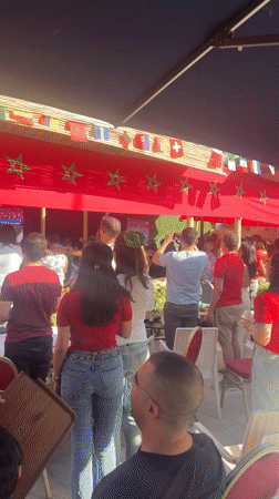 Multinational outdoor gathering under flags in Tangier