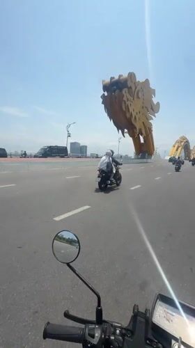 Motorcyclist crosses iconic Dragon Bridge in Da Nang