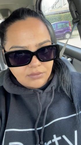 Woman in sunglasses sits in driver's seat, Dronten