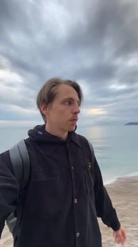 Young man walks coastal path in Bar, Montenegro