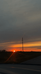 Sunset observed from moving vehicle in rural Alexandrovka, Russia
