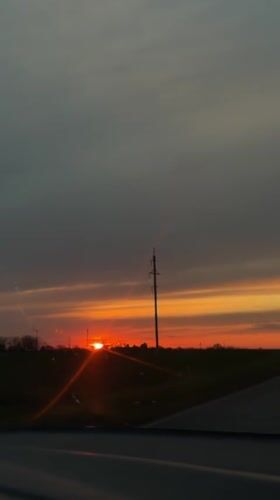 Sunset observed from moving vehicle in rural Alexandrovka, Russia