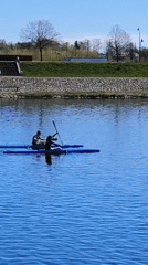 Morning kayakers paddle calm waters in Jelgava, Latvia