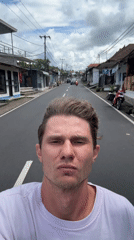 Motorcyclist Films Selfie While Riding in Tegallalang, Indonesia