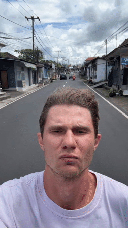 Motorcyclist Films Selfie While Riding in Tegallalang, Indonesia