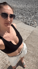 Woman enjoys sunny beach day in Sochi