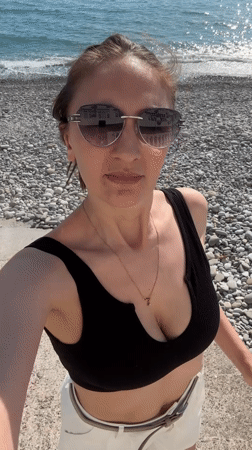 Woman enjoys sunny beach day in Sochi