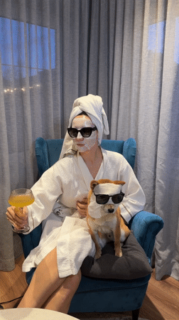 Woman and Shiba Inu photographed together in Carnikava home