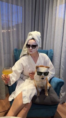 Woman and Shiba Inu photographed together in Carnikava home