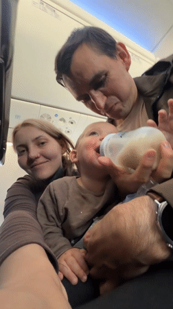 Family with baby observed feeding during flight at Domodedovo