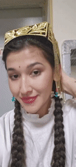 Woman in traditional golden headpiece photographed in Tashkent