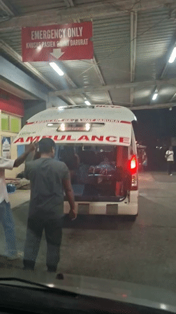 Ambulances gather at Banda Aceh emergency facility during evening hours