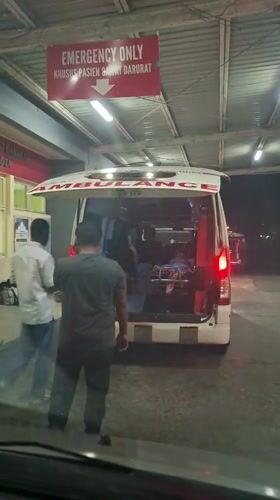 Ambulances gather at Banda Aceh emergency facility during evening hours
