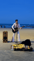Elvis impersonator performs on Barcelona beach boardwalk