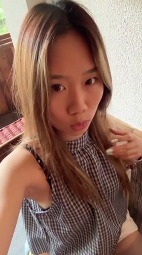 Woman poses for video in Liangjiang, China