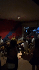 Musical gathering at São Paulo bar features instruments and drinks
