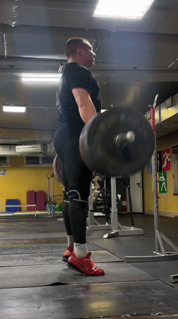 Weightlifter performs deadlifts at Blagoveshchensk gym