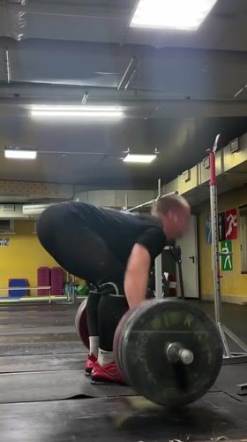 Weightlifter performs deadlifts at Blagoveshchensk gym