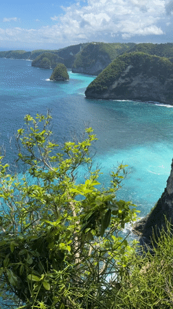Coastal cliffs and blue waters observed from Nusa Penida