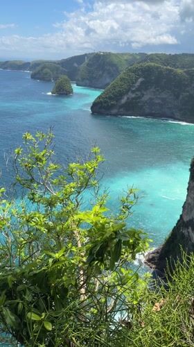 Coastal cliffs and blue waters observed from Nusa Penida