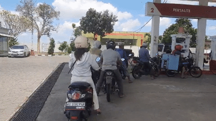 Motorcycle queue at a Pertamina station in Ploso, Indonesia