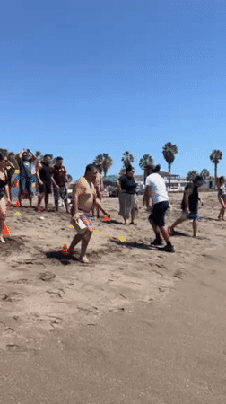 Sunny afternoon beach activities unfold in Arica, Chile