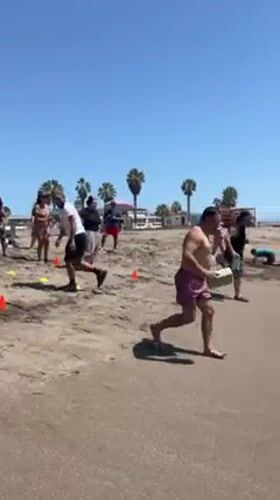 Sunny afternoon beach activities unfold in Arica, Chile