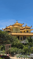 Traditional yellow Asian building documented on Da Lat hillside