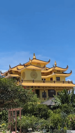 Traditional yellow Asian building documented on Da Lat hillside