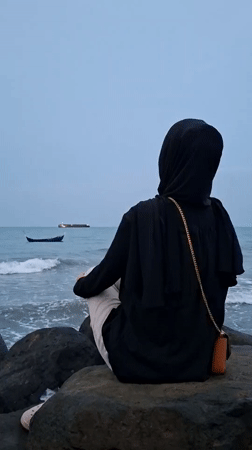 Quiet afternoon on the Lhokseumawe shoreline, rocks and open water