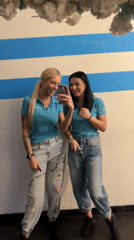 Two women take mirror selfies in Plovdiv, Bulgaria