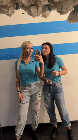 Two women take mirror selfies in Plovdiv, Bulgaria