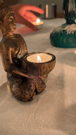 Candlelit tarot session with a Buddha statue in Montenegro