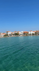 Elafonisos harbor and coastline on a clear summer morning